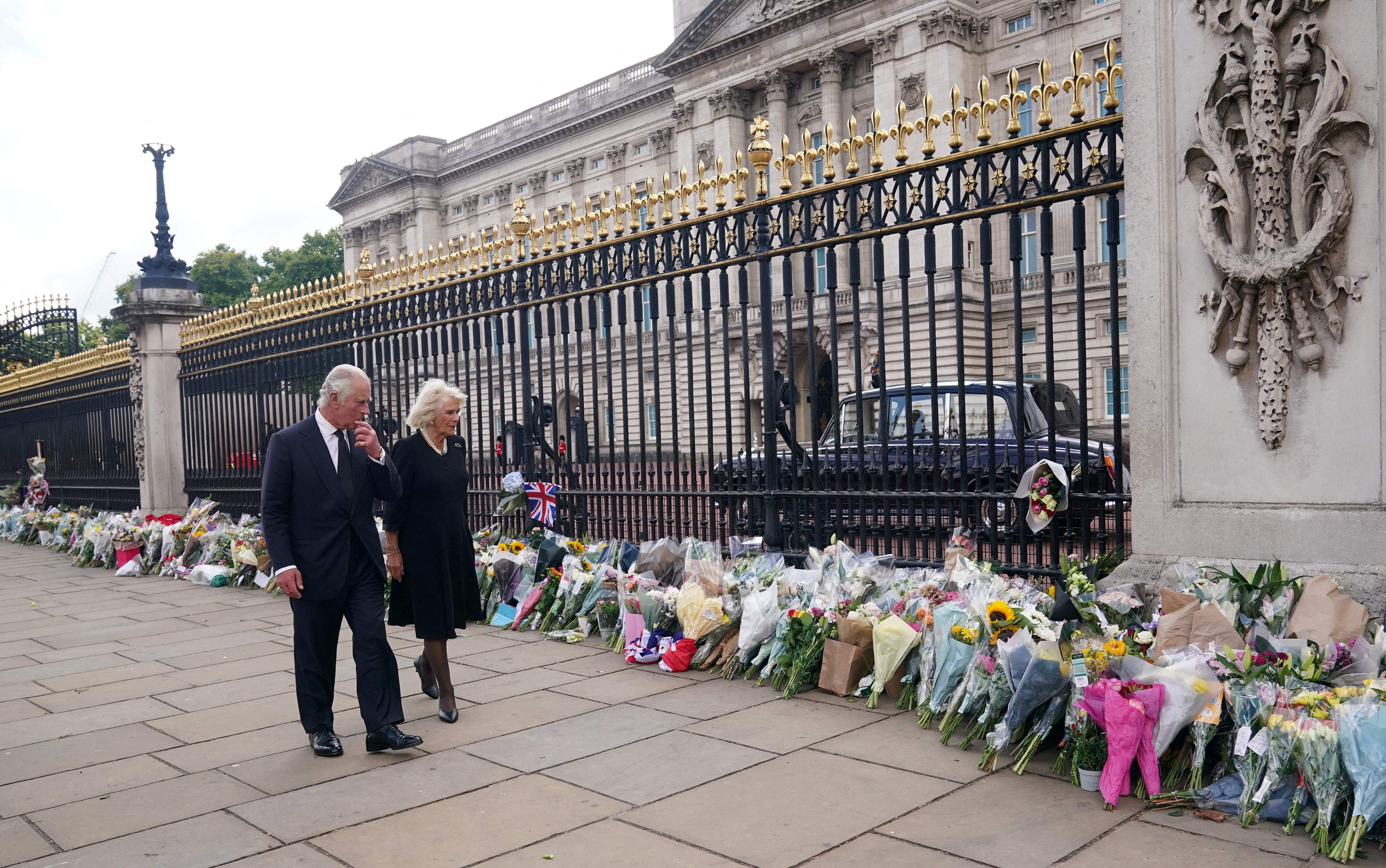 King Charles III's First Address: Britain's King Charles III and Britain's Camilla, Queen Consort view floral tributes. (AFP)