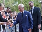 Britain's King Charles III greets well-wishers as he returns to Clarence House from Buckingham Palace in London, on September 10.