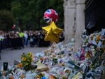 Queen Elizabeth II death: Flowers and balloons for Queen Elizabeth II are placed at the gates outside Buckingham Palace, in London.(AP) Queen Elizabeth II death: Flowers and balloons for Queen Elizabeth II are placed at the gates outside Buckingham Palace, in London.(AP)