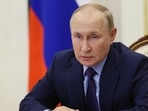 King Charles III: Russian President Vladimir Putin attends a meeting.