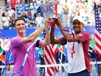 Rajeev Ram of the USA (right) and Joe Salisbury of the United Kingdom celebrate their Men's doubles championship win on day twelve of the 2022 U.S. Open tennis tournament.