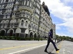Mumbai police personnel patrol outside Taj Hotel in Mumbai. Mumbai police personnel patrol outside Taj Hotel in Mumbai.