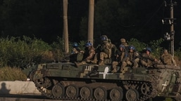 Russia-Ukraine War: Ukrainian army's fighters sit on the top of an armed vehicle in Kharkiv.