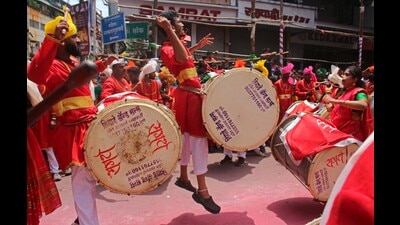 A dhol tasha group performs at a Ganesh immersion procession on Laxmi road on Friday. (Ravindra Joshi/HT PHOTO)
