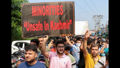 Members of All Migrant (Displaced) Employees Association Kashmir shout slogans during a protest in Jammu on Saturday. (PTI)