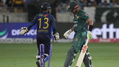 Pakistan's captain Babar Azam, right, reacts as he leaves the field after losing his wicket during the T20 cricket match of Asia Cup (AP) Pakistan's captain Babar Azam, right, reacts as he leaves the field after losing his wicket during the T20 cricket match of Asia Cup (AP)