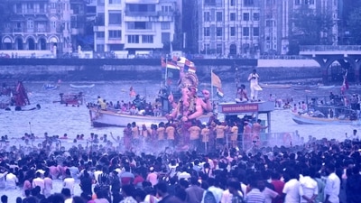 Lalbaugcha Raja is transferred into the boat in preparation for the visarjan. (HT Photos by Pratik Chorge)