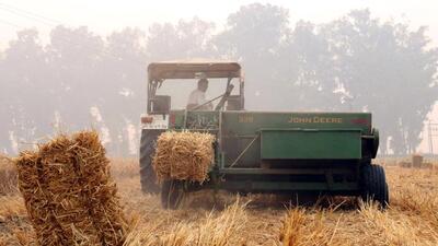 A hay baler at work in Chak Duhe Wala village in Muktsar, Punjab, on Saturday. (Sanjeev Kumar/Hindustan Times)