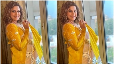 Sonali accessorised her traditional avatar with ornate gold jhumkis, matching statement rings, stilettos and a dainty bindi. Lastly, she left her curly tresses open in a side parting and styled them in soft curls. (Instagram) Sonali accessorised her traditional avatar with ornate gold jhumkis, matching statement rings, stilettos and a dainty bindi. Lastly, she left her curly tresses open in a side parting and styled them in soft curls. (Instagram)
