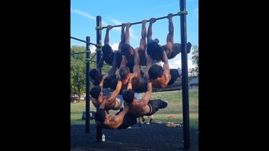 The image, taken from the viral Instagram video, shows nine men doing calisthenics(Instagram/@ad_mors) The image, taken from the viral Instagram video, shows nine men doing calisthenics(Instagram/@ad_mors)