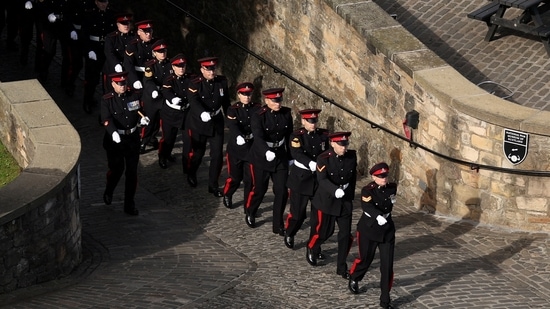 King Charles III Accession: Soldiers march to participate in a gun salute for Britain's King Charles.(Reuters)