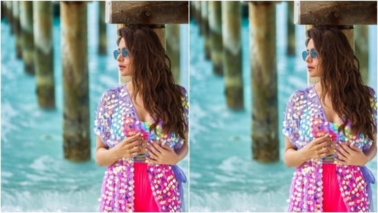 Aamna’s Maldives diaries are drool-worthy. A few days back, the actor decked up in a multicoloured tie and dye bra and a pair of bright pink shorts as she posed by the sea.(Instagram/@aamnasharifofficial)