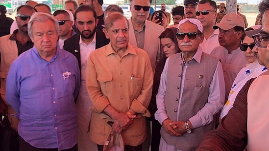 Pakistan's Primer Minister Shehbaz Sharif and United Nations Secretary-General Antonio Guterres (L) attend a briefing during their visit to flood-affected areas.(AFP)