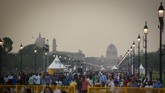 The ‘Kartavya Path’ has been lined with lush lawns, 16.5km of red granite walkways, refurbished canals, repaired and polished facades, public amenities, special vending zones, and improved signages.(Sanchit Khanna/Hindustan Times)