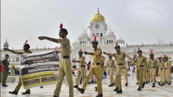 NCC cadets during a march to Gurdwara Saragarhi Sahib to mark the 125th anniversary of the battle of Saragarhi, in Amritsar on Saturday. Punjab local bodies minister Dr Inderbir Singh Nijjar said in his address that Sikh history is a guide for the youth and especially, the knowledge about the martyrs of Saragarhi is very important for children. (Sameer Sehgal /HT)