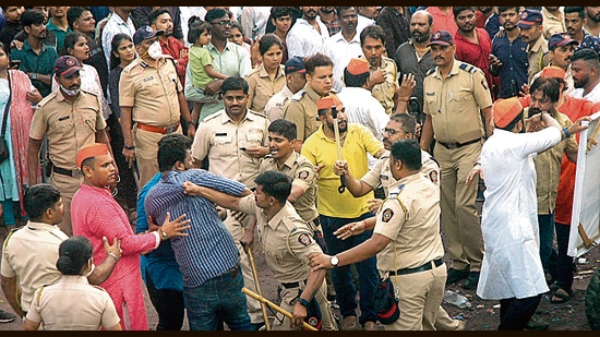 Police personnel discipline the crowd at Tilak chowk on Friday. (HT PHOTO)