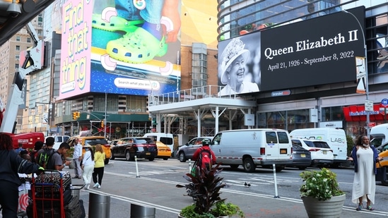 A tribute billboard for Queen Elizabeth II is seen on Eighth Avenue on September 09, 2022, in New York, (Michael M Santiago/Getty Images/AFP)