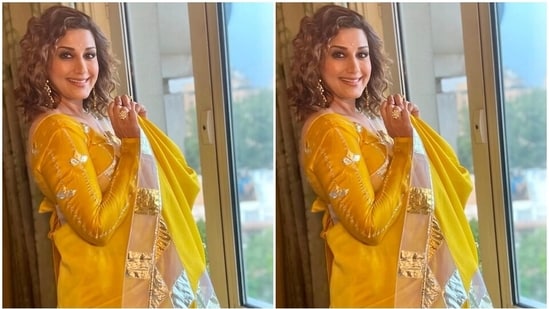 Sonali accessorised her traditional avatar with ornate gold jhumkis, matching statement rings, stilettos and a dainty bindi. Lastly, she left her curly tresses open in a side parting and styled them in soft curls.(Instagram)
