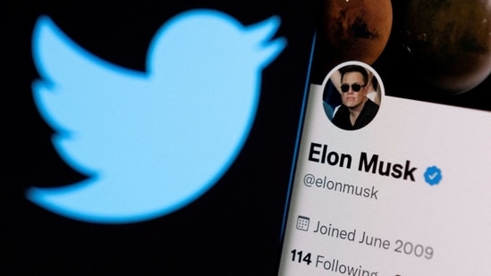Elon Musk's twitter account is seen on a smartphone in front of the Twitter logo(REUTERS)