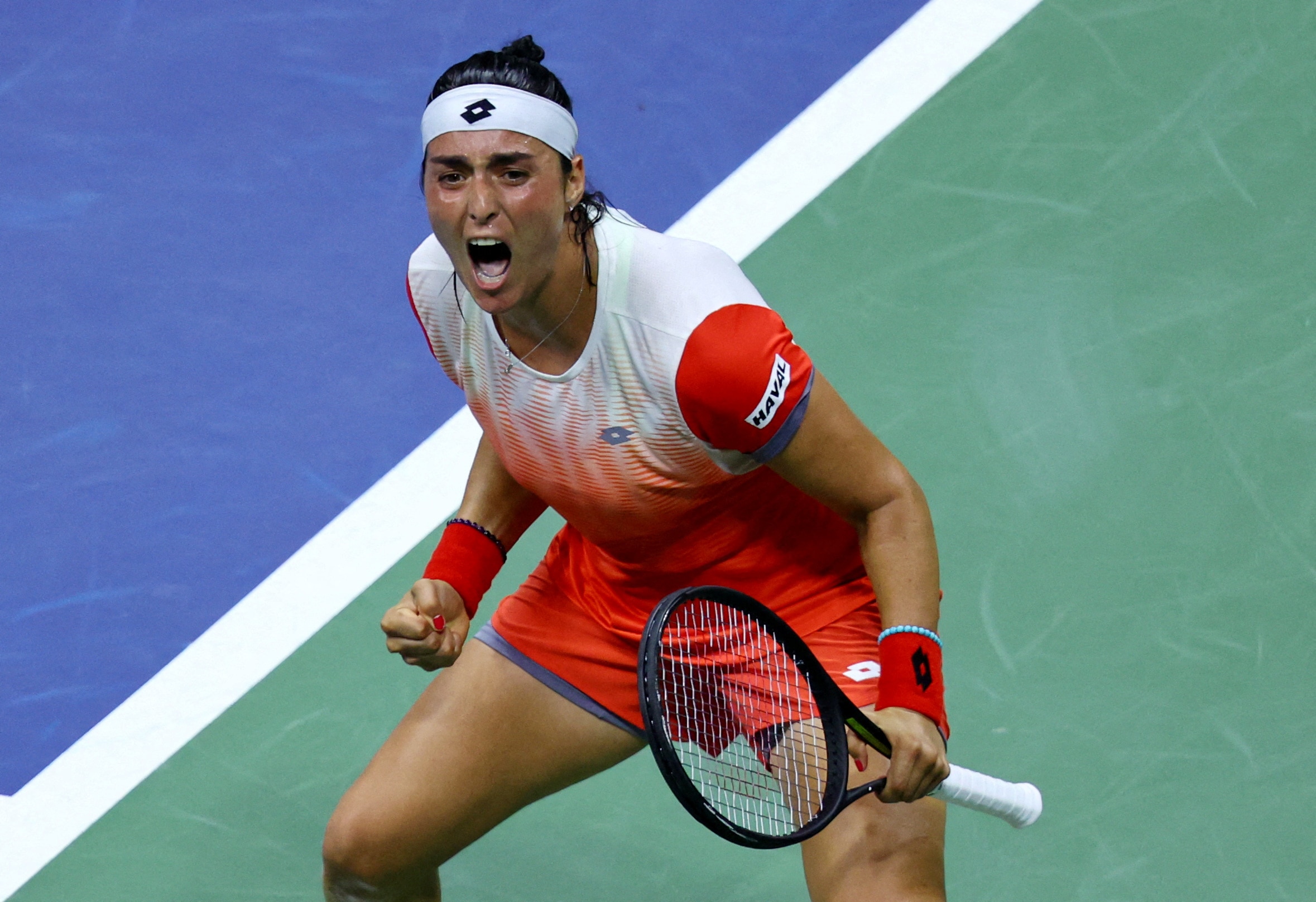 Tunisia's Ons Jabeur celebrates after winning her semifinal match against France's Caroline Garcia (REUTERS)