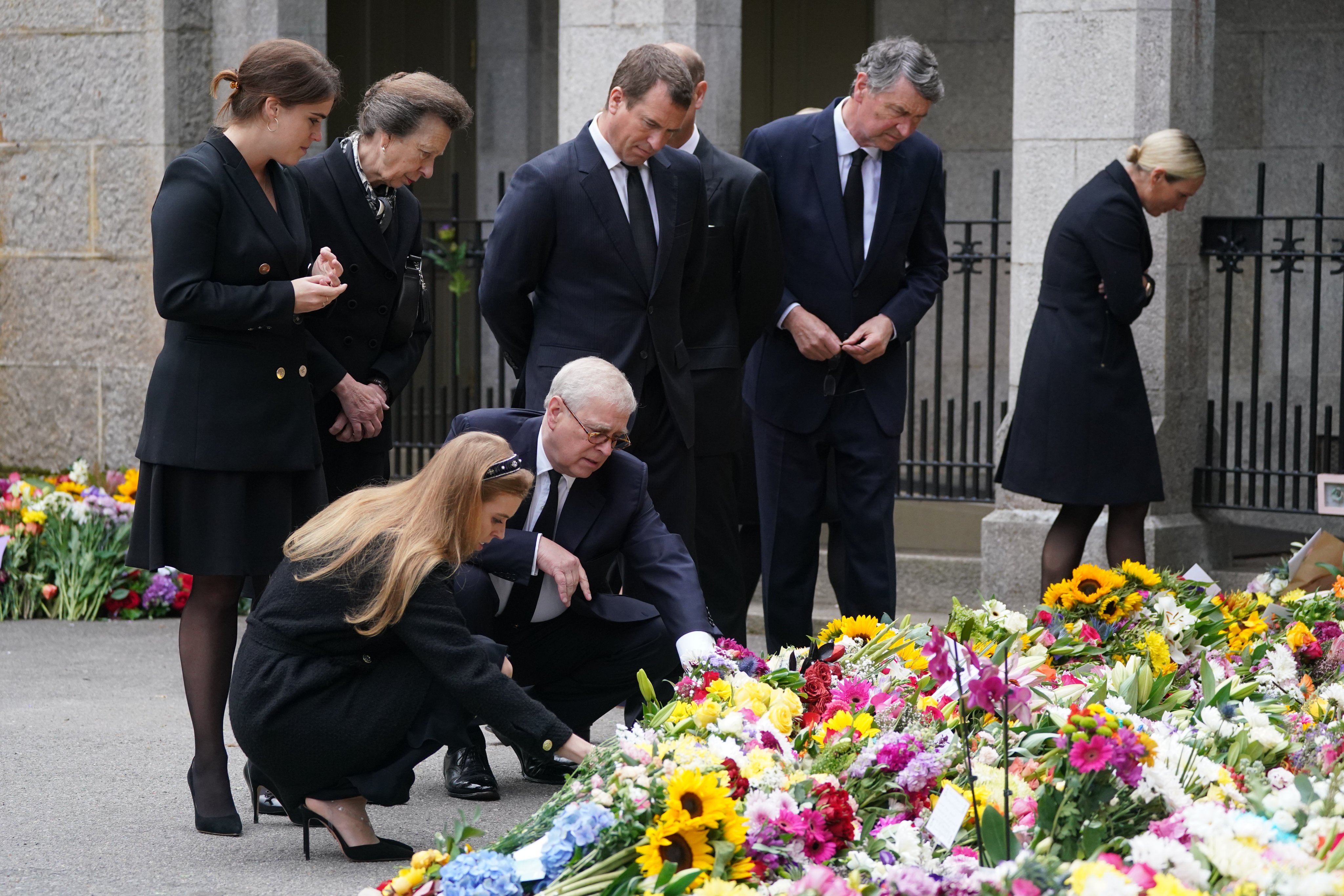 Queen's family members check the floral tributes at Balmoral(Twitter/@RoyalFamily)