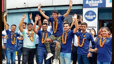 Ludhiana district topper in JEE Advanced Aryaman Angurman (centre) celebrating with friends after the results were announced on Sunday. (Harvinder Singh/HT) Ludhiana district topper in JEE Advanced Aryaman Angurman (centre) celebrating with friends after the results were announced on Sunday. (Harvinder Singh/HT)