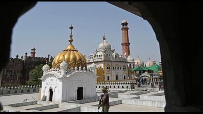 A policeman stands guard at a gurdwara in Lahore in June 2022, as Sikh pilgrims from India and other parts of the world arrived in Pakistan to take part in religious rituals for the fifth Sikh Guru Arjan Dev Ji's 416th death anniversary. (AFP/Representational image)