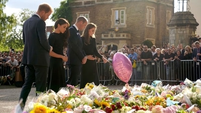 Prince Harry and Prince William with Meghan Markle and Kate Middleton viewed the floral tributes, notes, balloons and more left by the well-wishers in honour of the late Queen Elizabeth II. The Queen died on September 8, 2022, at Balmoral Castle, aged 96, after reigning for 70 years. Her family gathered at her Scottish estate after concerns about her health grew earlier on Thursday. (AFP)