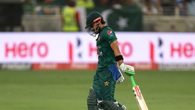 Cricket - Asia Cup - Final - Pakistan v Sri Lanka - Dubai International Stadium, Dubai, United Arab Emirates - September 11, 2022 Pakistan's Mohammad Rizwan walks after losing his wicket REUTERS/Christopher Pike (REUTERS)