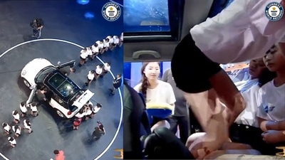The image, taken from the video tweeted by Guinness World Records, shows 29 people entering inside a five-seater Mini Cooper to create a world record. (Twitter/@GWR) The image, taken from the video tweeted by Guinness World Records, shows 29 people entering inside a five-seater Mini Cooper to create a world record. (Twitter/@GWR)