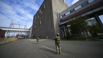 Russian servicemen guard an area of the Zaporizhzhia Nuclear Power Station, the largest nuclear power plant in Europe. (AP) Russian servicemen guard an area of the Zaporizhzhia Nuclear Power Station, the largest nuclear power plant in Europe. (AP)