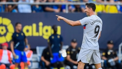 Robert Lewandowski gestures after scoring his side's second goal during Spanish la Liga &nbsp;match between Cadiz FC and FC Barcelona at the Nuevo Mirandilla (AP)