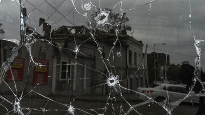 A building damaged by a Russian missile strike is reflected in a window broken with shrapnel, amid Russia's attack on Ukraine in central Dnipro, on Sunday.&nbsp; (REUTERS)