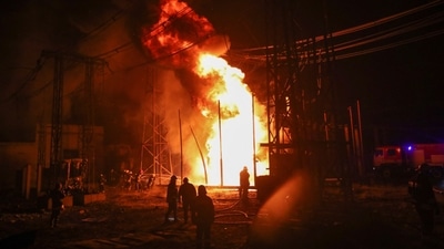Firefighters work at a site of a thermal power plant damaged by a Russian missile strike, amid Russia's attack on Ukraine, in Kharkiv. (REUTERS)