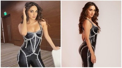 Kiara Advani's sparkling black catsuit made of latex makes her look like a glam queen. The outfit's contours were beautifully emphasised by a corset bodice and silver embroidered accents flowing longitudinally and cutting across the ensemble. Her outfit was completed with a shirt, ankle boots, and waves. (Instagram/Kiara Advani) Kiara Advani's sparkling black catsuit made of latex makes her look like a glam queen. The outfit's contours were beautifully emphasised by a corset bodice and silver embroidered accents flowing longitudinally and cutting across the ensemble. Her outfit was completed with a shirt, ankle boots, and waves. (Instagram/Kiara Advani)