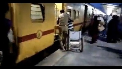 The image shows an RPF personnel helping the specially-abled passenger board the train. (Twitter/@supriyasahuias) The image shows an RPF personnel helping the specially-abled passenger board the train. (Twitter/@supriyasahuias)
