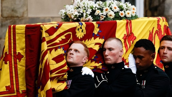 Pallbearers carry the coffin of Britain's Queen Elizabeth as the hearse arrives at the Palace of Holyroodhouse in Edinburgh, Scotland, Britain,(REUTERS)