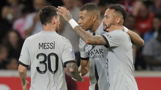 Lionel Messi, Kylian Mbappe, and Neymar react after scoring a goal during the French League One match&nbsp;(AP)