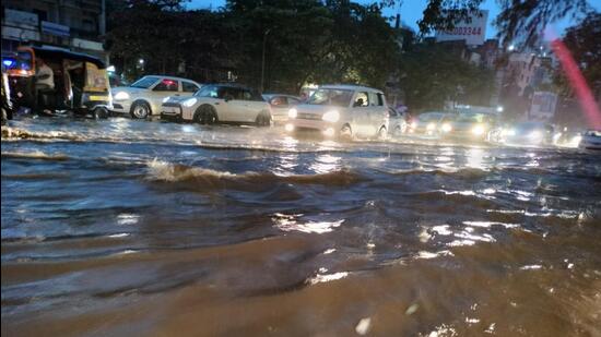 A two-hour intense rainfall in Pune city on Sunday evening left several areas waterlogged, huge traffic jams, power supply disruptions and flooded parking lots, disturbing the normal life of residents. (HT)