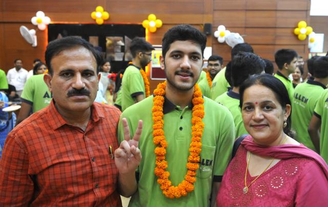 Harsh Jhakar celebrating his success with his parents. He got an AIR of 48. (Keshav Singh/HT) Harsh Jhakar celebrating his success with his parents. He got an AIR of 48. (Keshav Singh/HT)