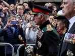 Britain's King Charles, Princess Anne and Prince Andrew, Duke of York, follow the hearse carrying the coffin of Britain's Queen Elizabeth on the Royal Mile in Edinburgh, Scotland, Britain September 12, 2022.