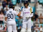England's Ollie Pope and Zak Crawley celebrate winning the match and series