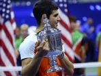 Spain's Carlos Alcaraz celebrates with the trophy after winning the U.S. Open