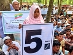 FILE PHOTO: Rohingya refugees hold placards as they gather at the Kutupalong Refugee Camp to mark the fifth anniversary of their fleeing from neighbouring Myanmar to escape a military crackdown in 2017, in Cox's Bazar, Bangladesh,&nbsp;