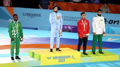 Wrestler Ravi Dahiya at the podium after winning a gold medal in men's 57kg freestyle wrestling category at the Commonwealth Games (CWG) 2022 (ANI Photo/ Saikhom Mirabai Chanu Twitter)) Wrestler Ravi Dahiya at the podium after winning a gold medal in men's 57kg freestyle wrestling category at the Commonwealth Games (CWG) 2022 (ANI Photo/ Saikhom Mirabai Chanu Twitter))