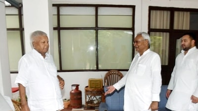 (File) Bihar Chief Minister Nitish Kumar meets Rashtriya Janata Dal (RJD) Chief Lalu Prasad Yadav after returning from Delhi in the presence of State Deputy Chief Minister Tejashwi Yadav, at the latter's residence, in Patna. (ANI Photo) (File) Bihar Chief Minister Nitish Kumar meets Rashtriya Janata Dal (RJD) Chief Lalu Prasad Yadav after returning from Delhi in the presence of State Deputy Chief Minister Tejashwi Yadav, at the latter's residence, in Patna. (ANI Photo)