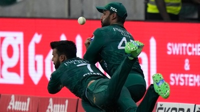 Pakistan's Shadab Khan, left, and Asif Ali collide in an unsuccessful attempt to take the catch of Sri Lanka's Bhanuka Rajapaksa (AP) Pakistan's Shadab Khan, left, and Asif Ali collide in an unsuccessful attempt to take the catch of Sri Lanka's Bhanuka Rajapaksa (AP)