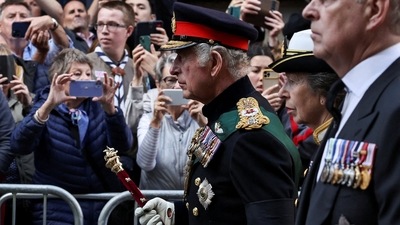 Britain's King Charles, Princess Anne and Prince Andrew, Duke of York, follow the hearse carrying the coffin of Britain's Queen Elizabeth on the Royal Mile in Edinburgh, Scotland, Britain September 12, 2022. (REUTERS)