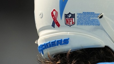 A detailed view of the 9/11 ribbon logo on the back of the helmet of Los Angeles Chargers quarterback Justin Herbert (10) at SoFi Stadium. (Kirby Lee/USA TODAY Sports)