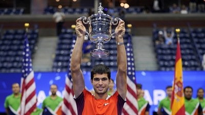 Carlos Alcaraz, of Spain, holds up the championship trophy after defeating Casper Ruud, of Norway, in the men's singles final of the U.S. Open (AP) Carlos Alcaraz, of Spain, holds up the championship trophy after defeating Casper Ruud, of Norway, in the men's singles final of the U.S. Open (AP)